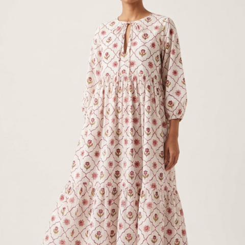 Women’s floral printed maxi dress featuring a keyhole neckline, long sleeves, and flowing tiered silhouette.